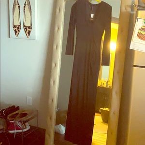 Long black maxi dress with high slit.
